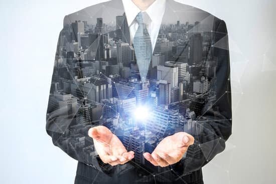 Image of a businessman holding a ball of light in his hands representing the vision leadership trait.