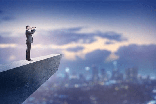 Man looking over town representing vision for the Leadership Quotes on Vision section.