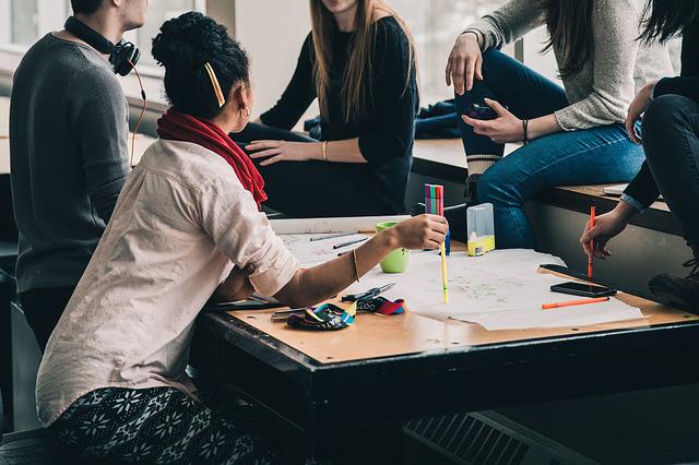 how to improve team performance: image of a meeting.