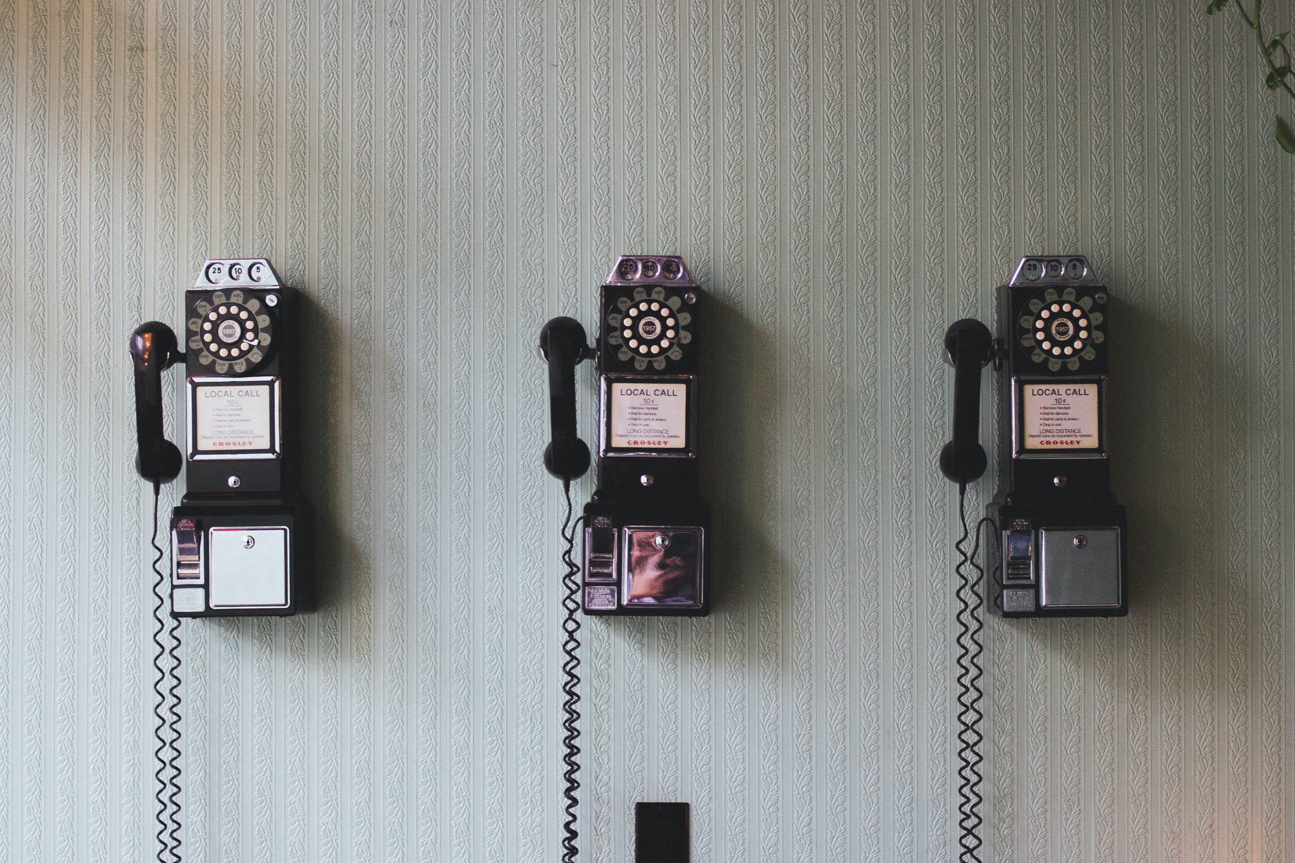 12 qualities of a good leader. Image of phones for communication.
